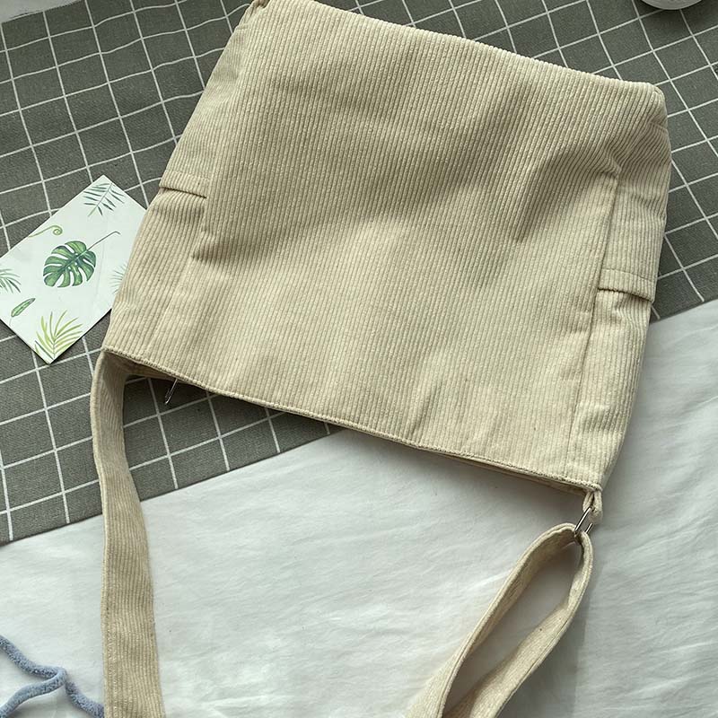 Axelväska i canvas med kottmönster – Avslappnad och elegant stil 
